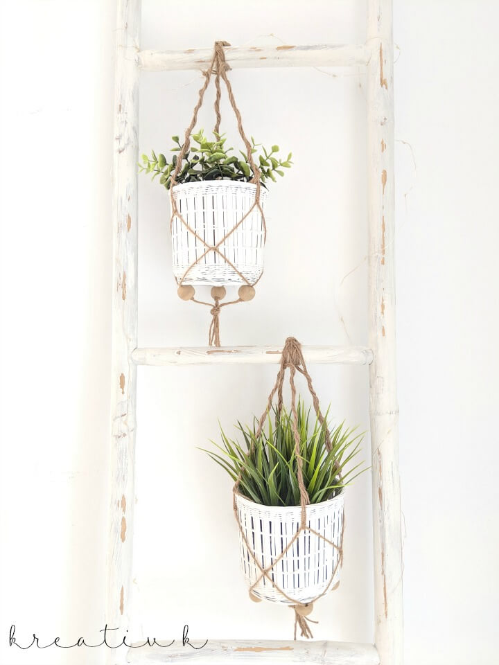 These succulent plants hanging on the vintage white ladder are adorable farmhouse style.