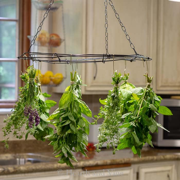 This unique herb drying rack adds to the farmhouse feel in this kitchen.