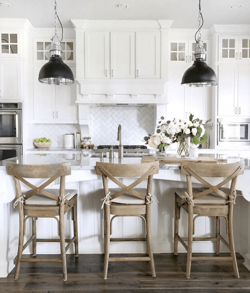 This lovely white farmhouse style kitchen mixes vintage with modern for a stunning look