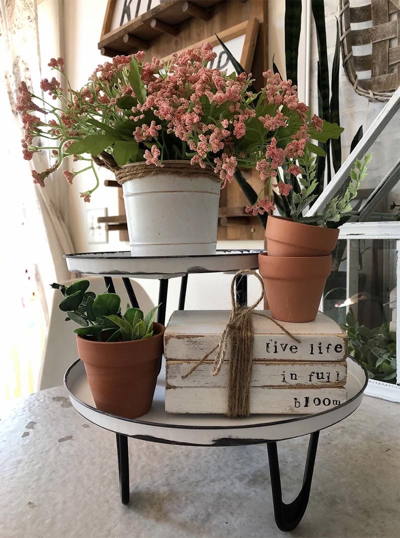 These Farmhouse Dollar Store Hacks With A High End Look will add the perfect touch of charm and style to your home. The best part is… it will not break the budget!