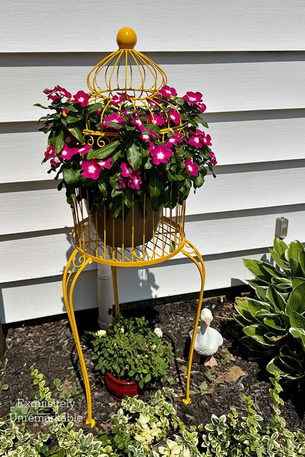 Old Metal Birdcage Turned Into a Cottage Garden Planter thrift store upcycle idea