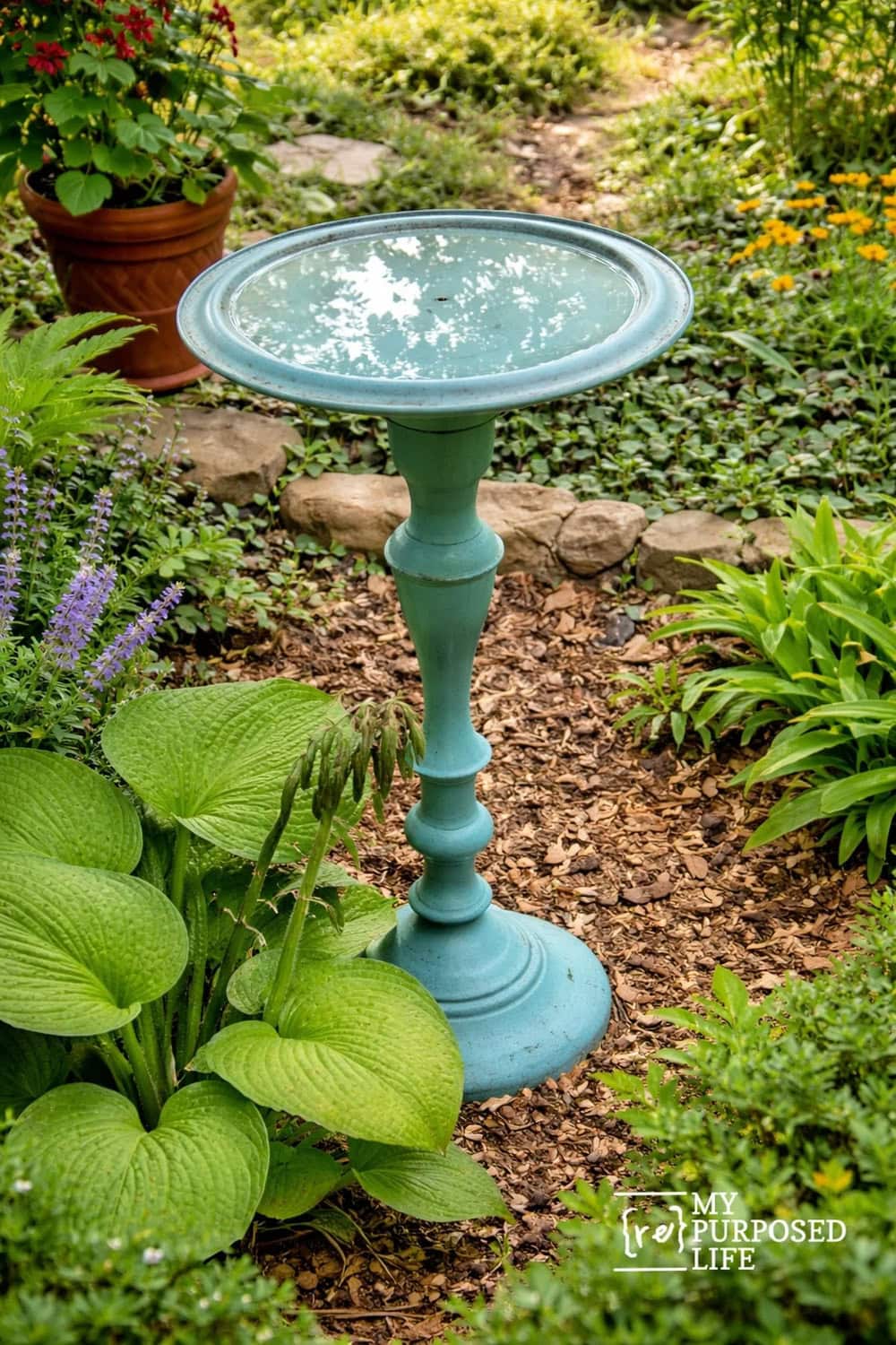 Oversized Candlestick Turned Into a Garden Birdbath thrift store upcycle idea