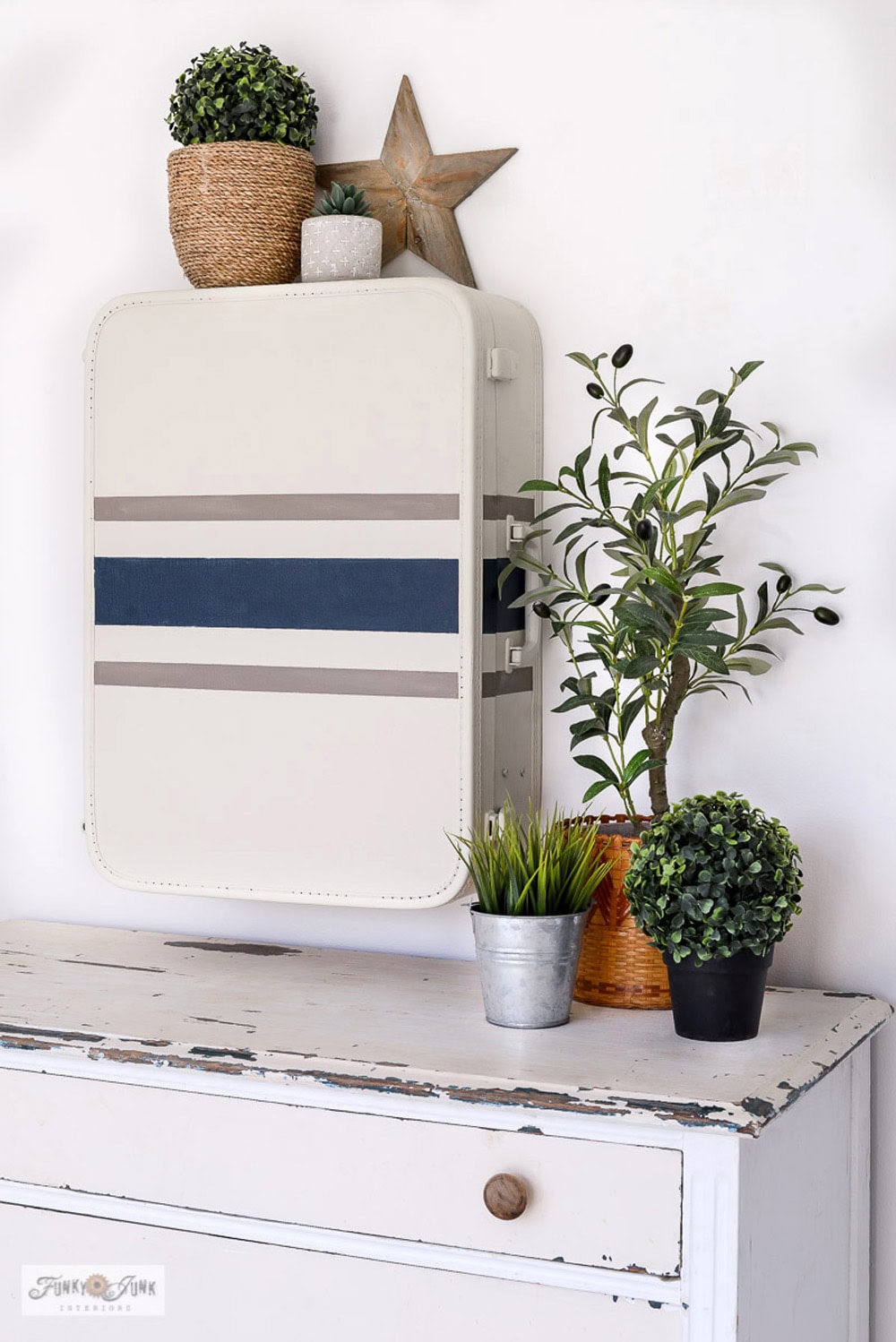 Vintage Suitcase Turned Into Hidden Wall Storage thrift store upcycle idea