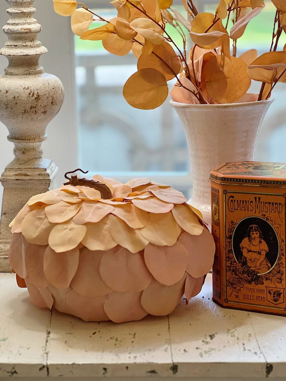 A Pumpkin Covered in Autumn Leaves featured in The Cottage Market Saturday Collection