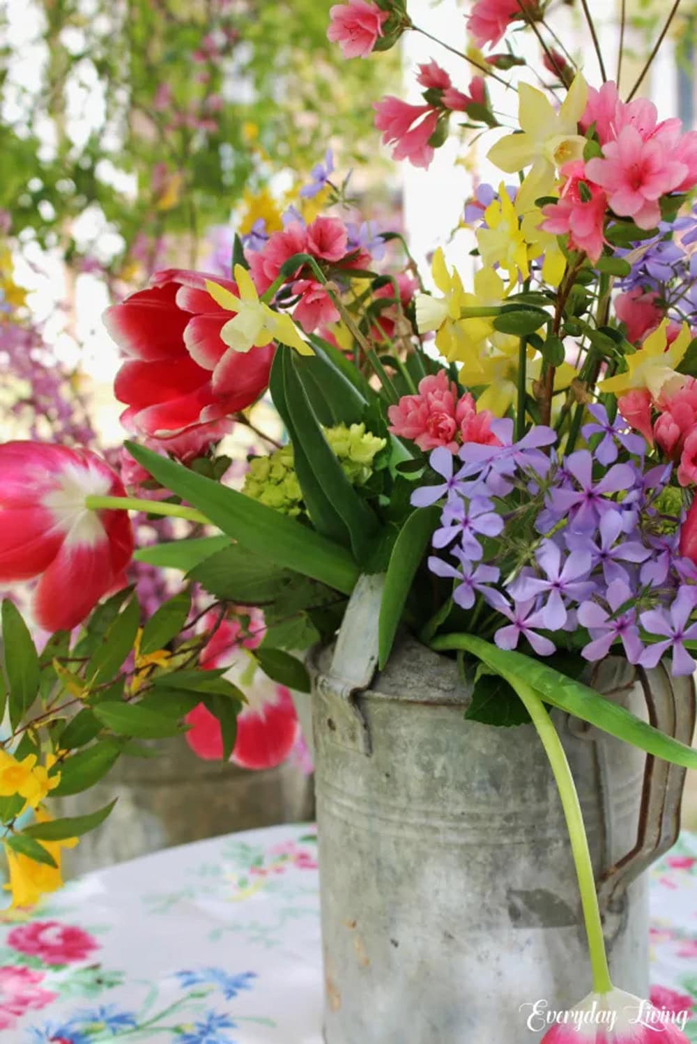 Vintage Watering Cans Filled With Garden Flowers floral inspiration featured on The Cottage Market