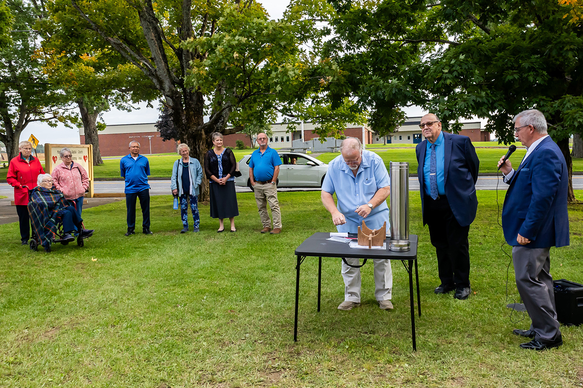 Mapleton church buries time capsule The County