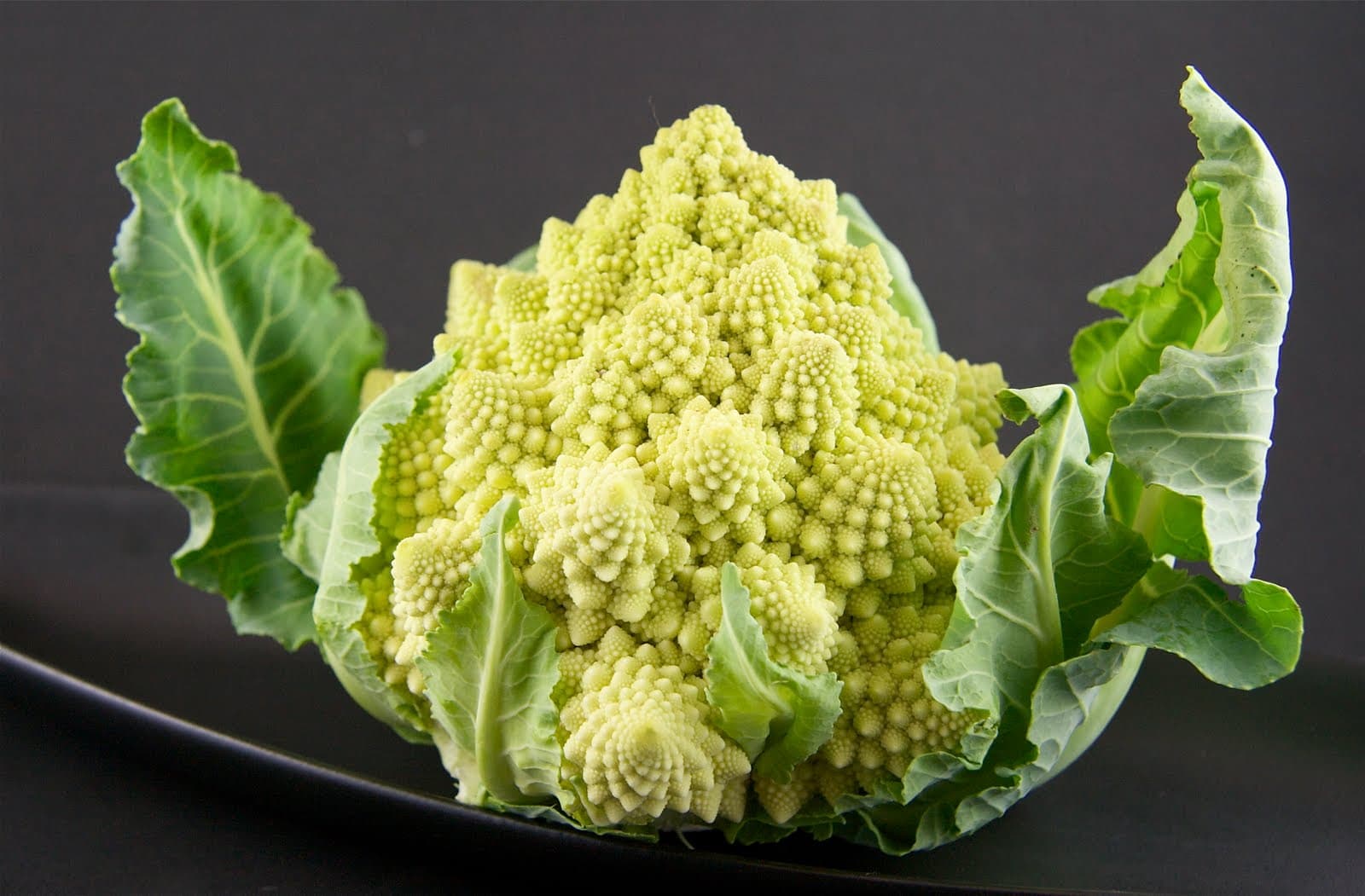 Whole Baked Romanesco Cauliflower with Tomato and Olive Sauce The