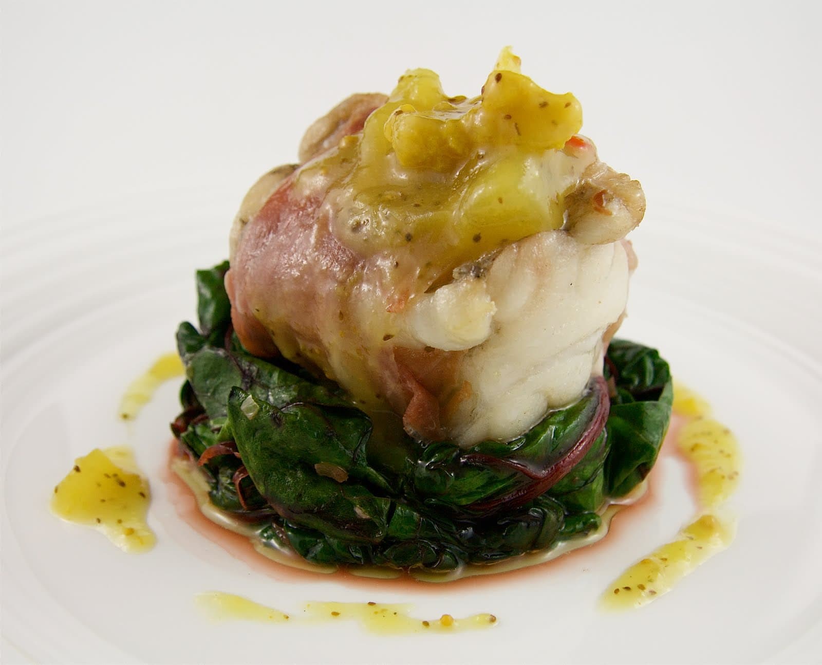 ProsciuttoWrapped Monkfish with Chard and Mustard Pickles The