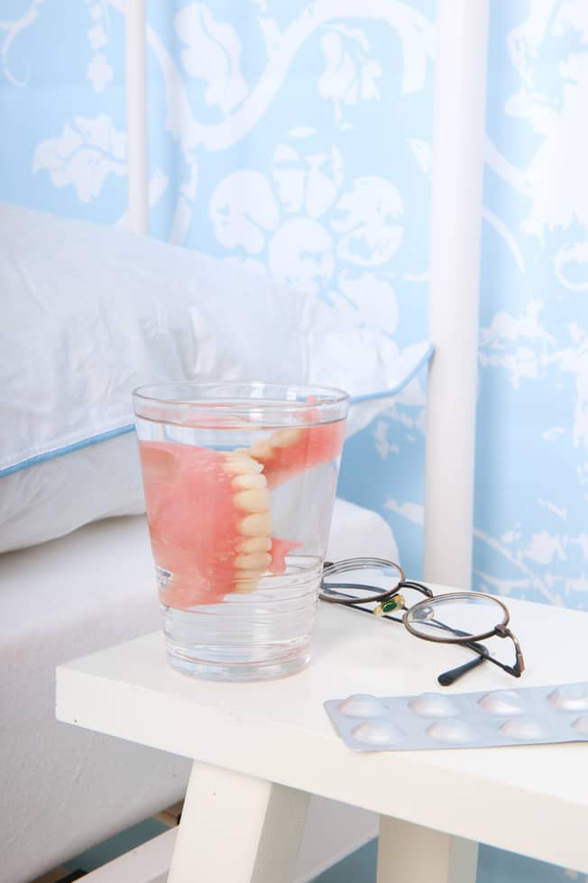 Is It Safe To Wear Dentures Overnight? The Denture and Implant Centre