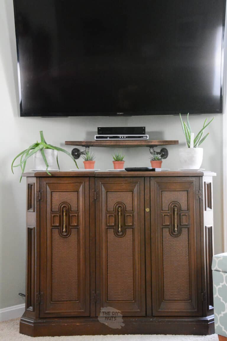 Build This Clever DIY Corner Shelf For Under Your Mounted TV Today