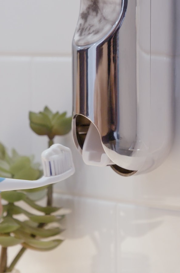 UpKit automatic toothpaste dispenser is a stylish bathroom accessory