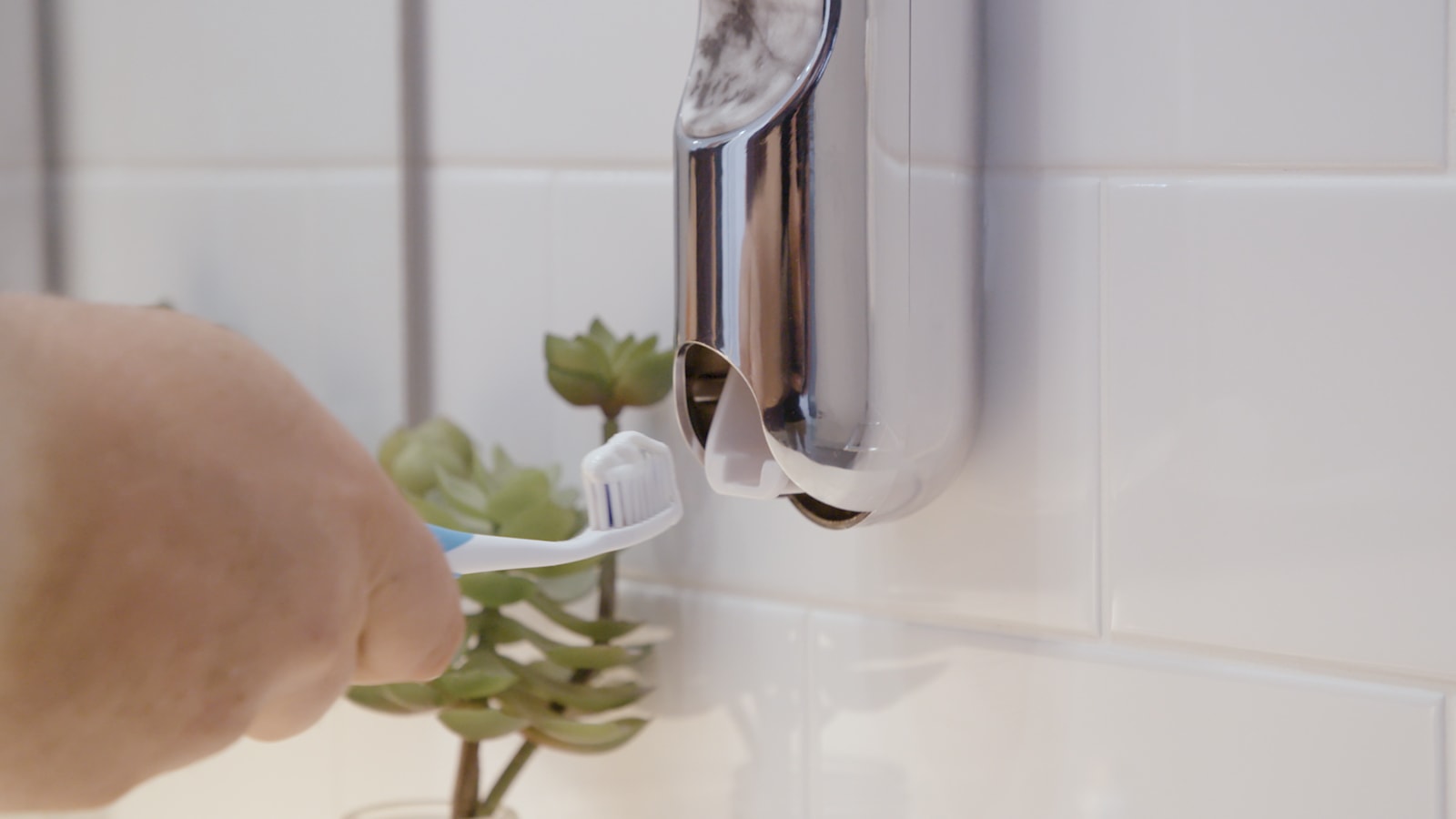 UpKit automatic toothpaste dispenser is a stylish bathroom accessory