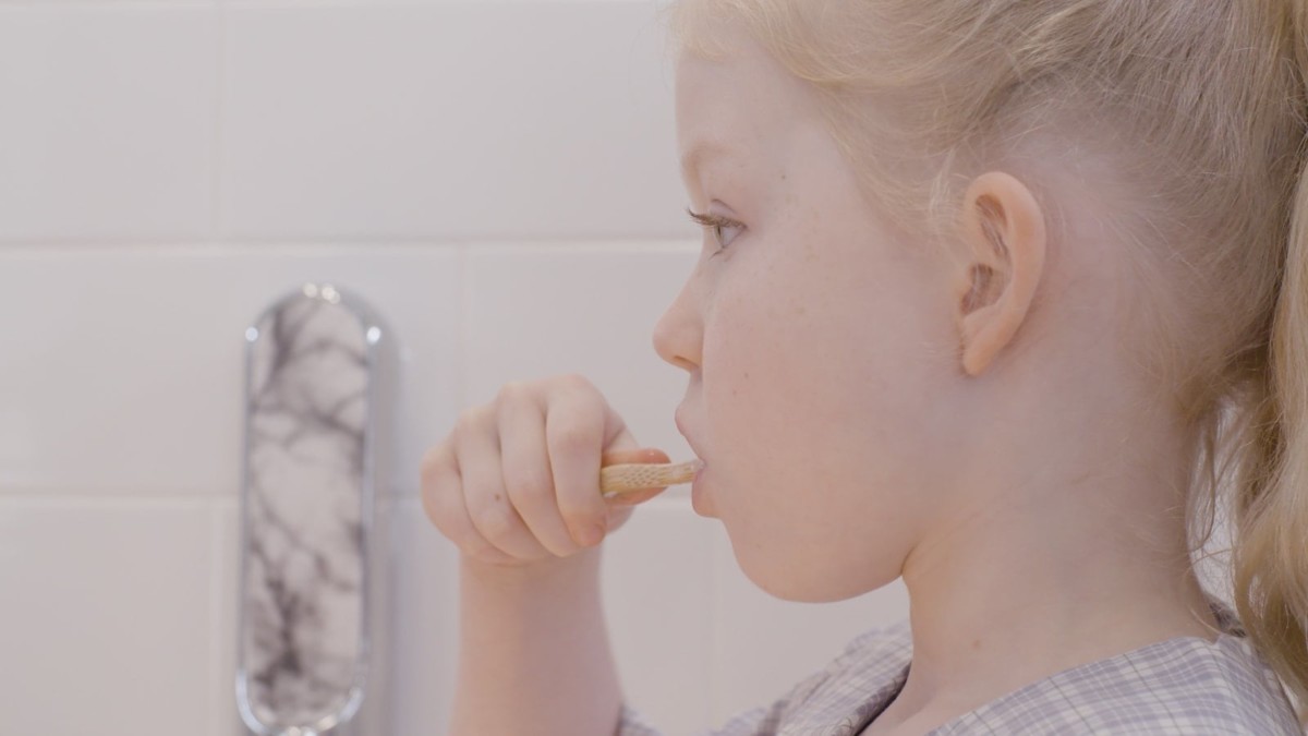 This stylish toothpaste dispenser makes it easier to keep your bathroom