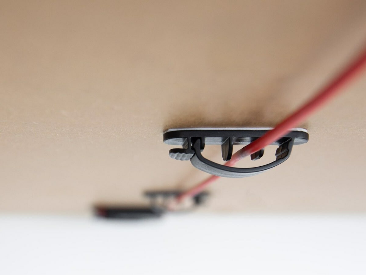 ElevationLab QuickDraw underdesk cord mount keeps cords hidden and