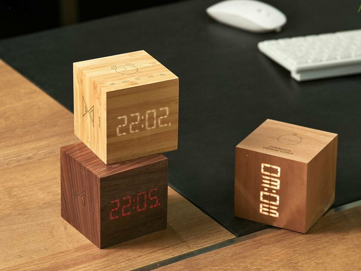 Gingko Cube Plus Clock has a solid wood design and combines a clock