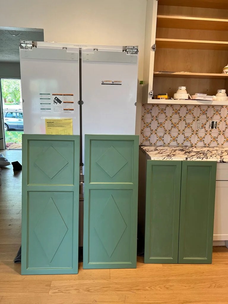 A fridge made to look like a The House That Lars Built