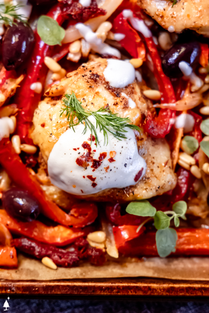 Simple, delicious, reliable, and easy to clean up, this Mediterranean chicken is everything you want from a weeknight dinner! #mediterraneanchicken #lowcarbmediterraneanchicken closer view of mediterranean chicken recipe