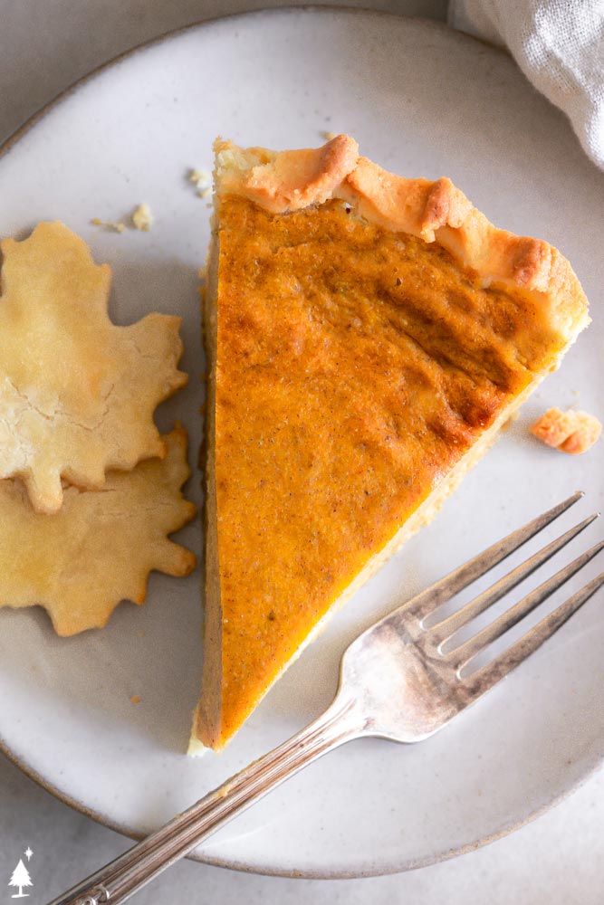 Silky, creamy, tender and sweet, this keto pumpkin pie is the only pie recipe you NEED this holiday season! #ketopumpkinpie #lowcarbpumpkinpie closer view of keto pumpkin pie recipe