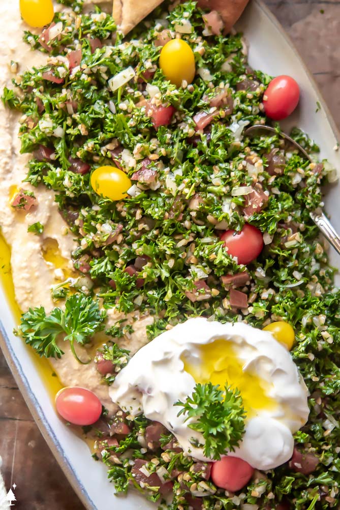 tabbouleh recipe on a platter with labneh