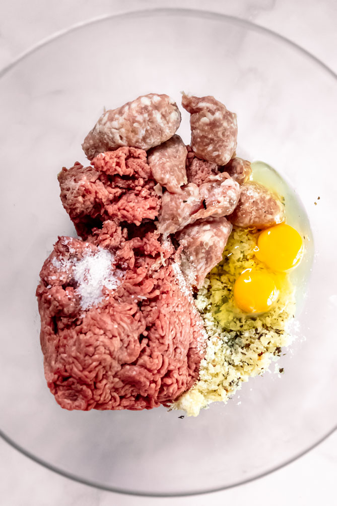 Making keto meatballs is an easy and delicious way to inject the spice of life into your meal plan without sacrificing million-dollar flavor! #lowcarbmeatballs #ketomeatballs best keto meatballs ingredients in a bowl