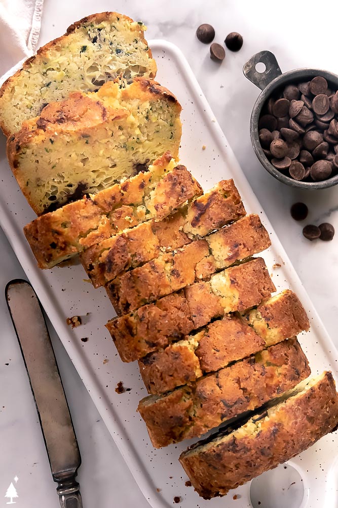Sweet, fluffy, super moist, and chocolatey, this low carb zucchini bread will make you love vegetables! #lowcarbzucchinibread #ketozucchinibread top view of sliced easy zucchini bread