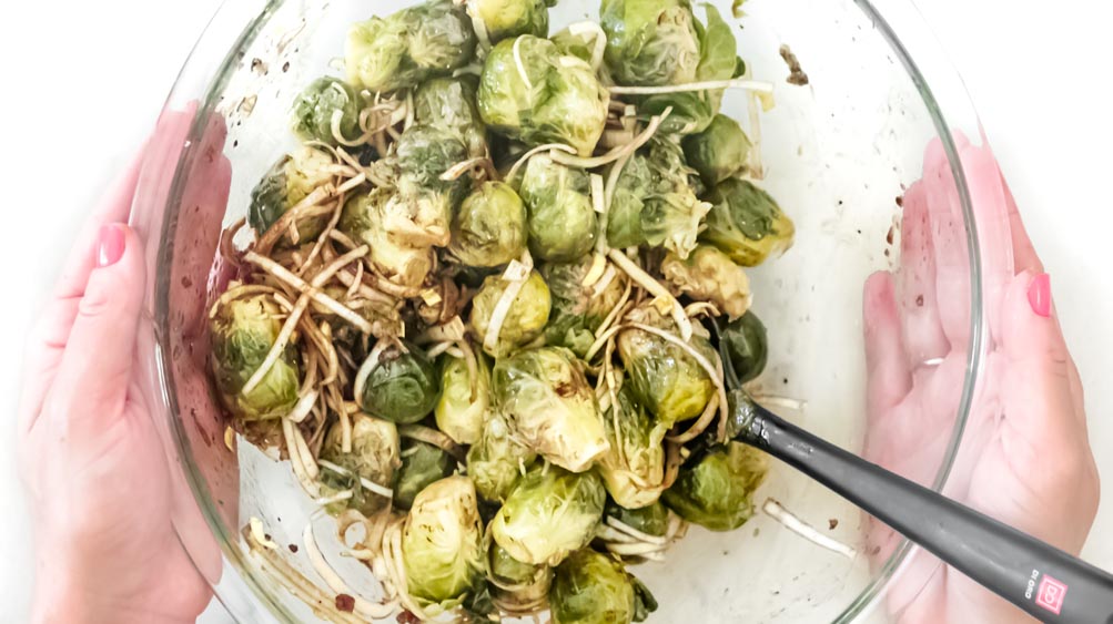 *NEW* Crispy baked parmesan cover these smashed brussels sprouts, for a tasty side dish that'll forever change the way you feel about this veggie! #smashedbrusselssprouts #lowcarbsmashedbrusselssprouts closer view of smashed brussels sprouts with parmesan