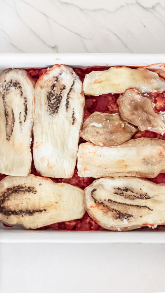 *NEW* This keto eggplant lasagna is made of three(!) cheeses and is every bit as decadent and comforting as a standard version. #ketoeggplantlasagna #lowcarblasagna top view of eggplant lasagna healthy