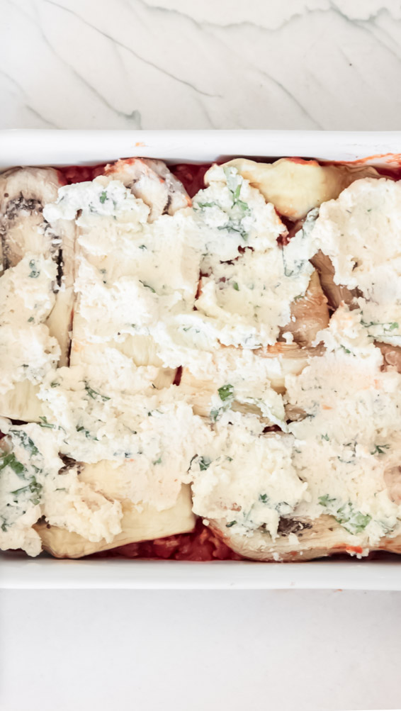 *NEW* This keto eggplant lasagna is made of three(!) cheeses and is every bit as decadent and comforting as a standard version. #ketoeggplantlasagna #lowcarblasagna top view of eggplant lasagna healthy