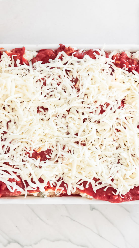 *NEW* This keto eggplant lasagna is made of three(!) cheeses and is every bit as decadent and comforting as a standard version. #ketoeggplantlasagna #lowcarblasagna top view of eggplant lasagna healthy
