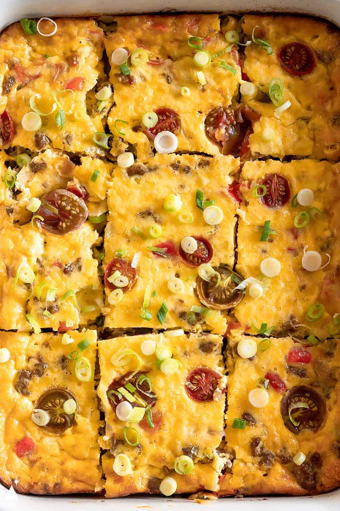 Zesty sausage, melty cheese, and sauteed veggies unite for a keto breakfast casserole that’s best described as convenience meets hearty! #ketobreakfastcasserole #lowcarbbreakfastcasserole top view of healthy breakfast casserole