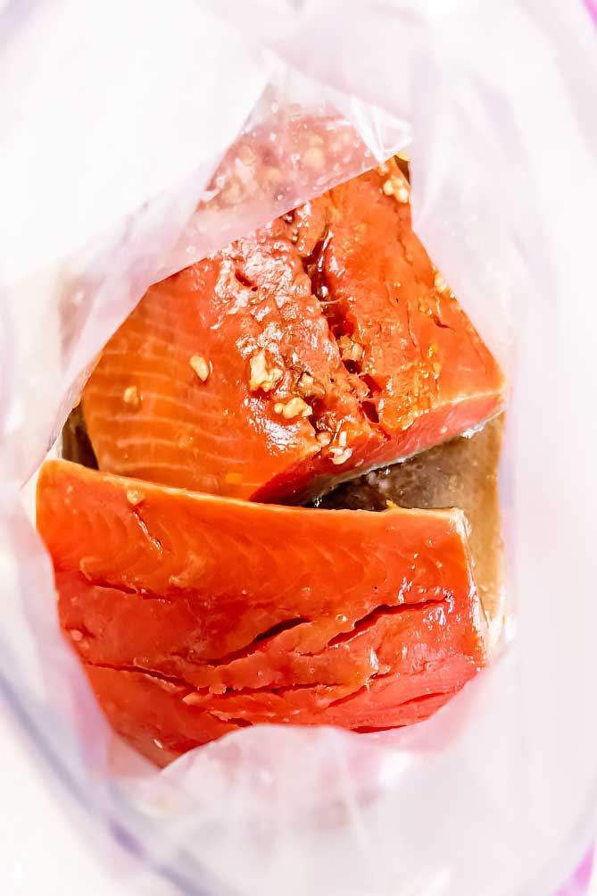 This bright and savory salmon marinade is perfect way to add loads of flavor in a matter of minutes! Great on the grill or in the oven. #salmonmarinade #lowcarbsalmonmarinade closer view of easy salmon marinade