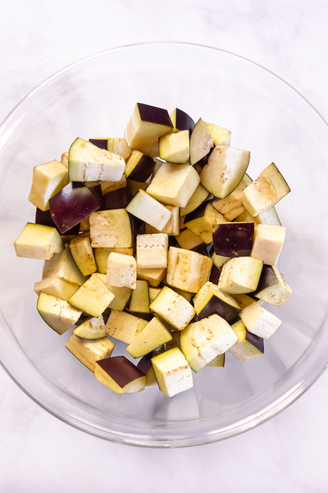 Flavorful, satisfying plus easy to make, this roasted eggplant is a perfect example of how tender and delicious roasted veggies can be! #roastedeggplant #lowcarbroastedeggplant top view of roasted eggplant slices
