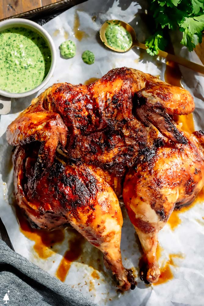 peruvian recipes on a baking sheet with green sauce on the side