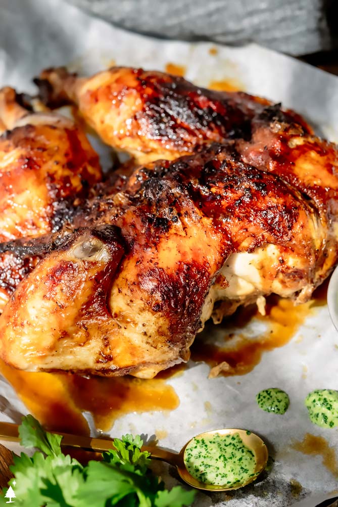 peru chicken on a baking sheet with cilantro