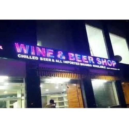 Larger than alloted size billboards displayed outside the wine shops in