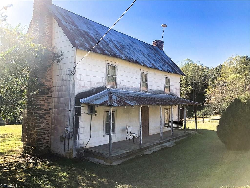 Fixer upper alert!! Six acres in the NC mountains. 20 minutes to Mount