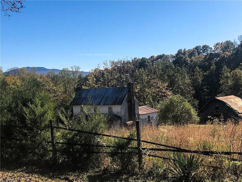 Fixer upper alert!! Six acres in the NC mountains. 20 minutes to Mount