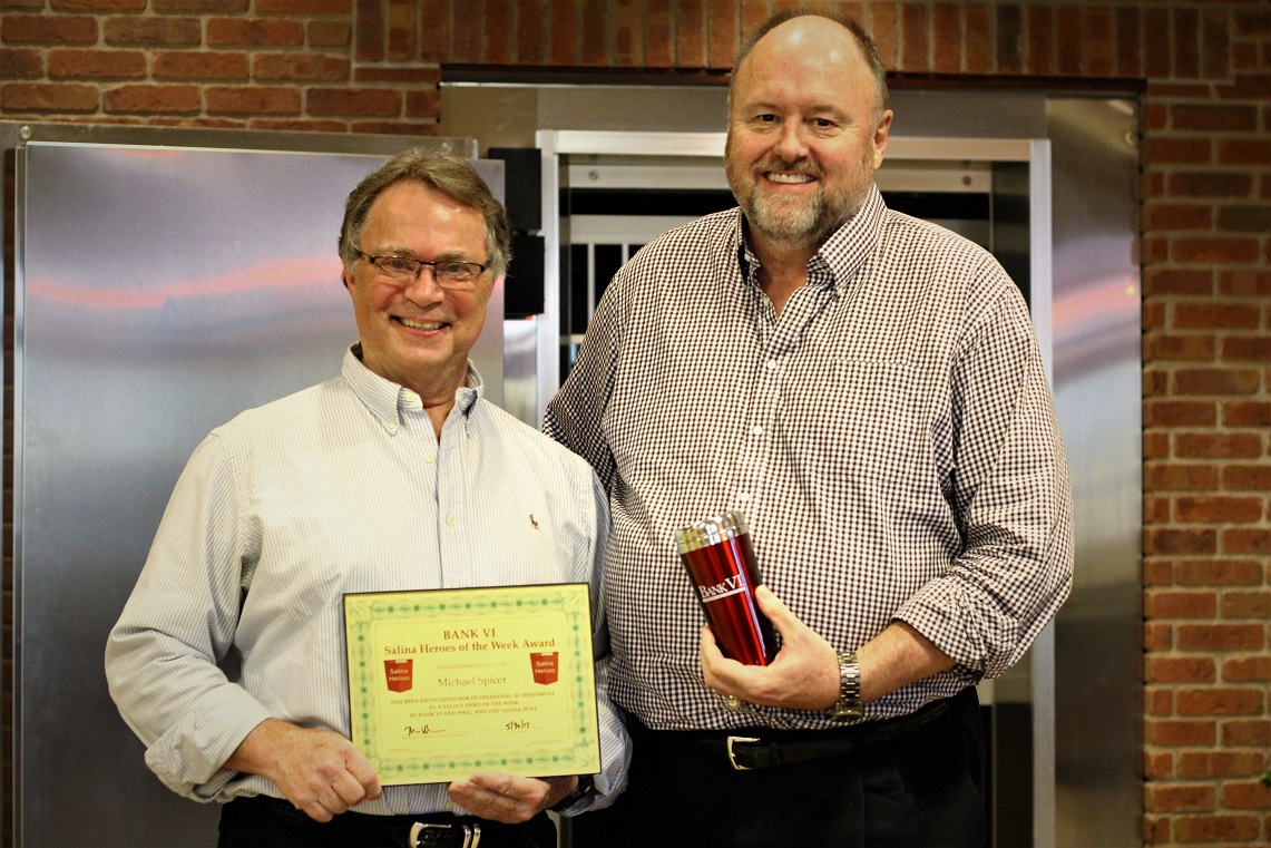 Michael Spicer is presented with the BANK VI Hero of the Week Award