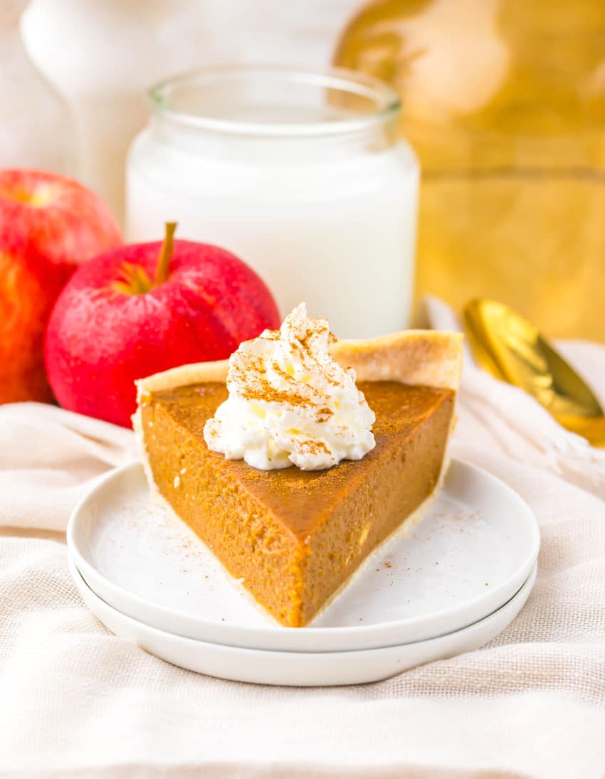 a slice of apple butter pie on a small white dessert plate