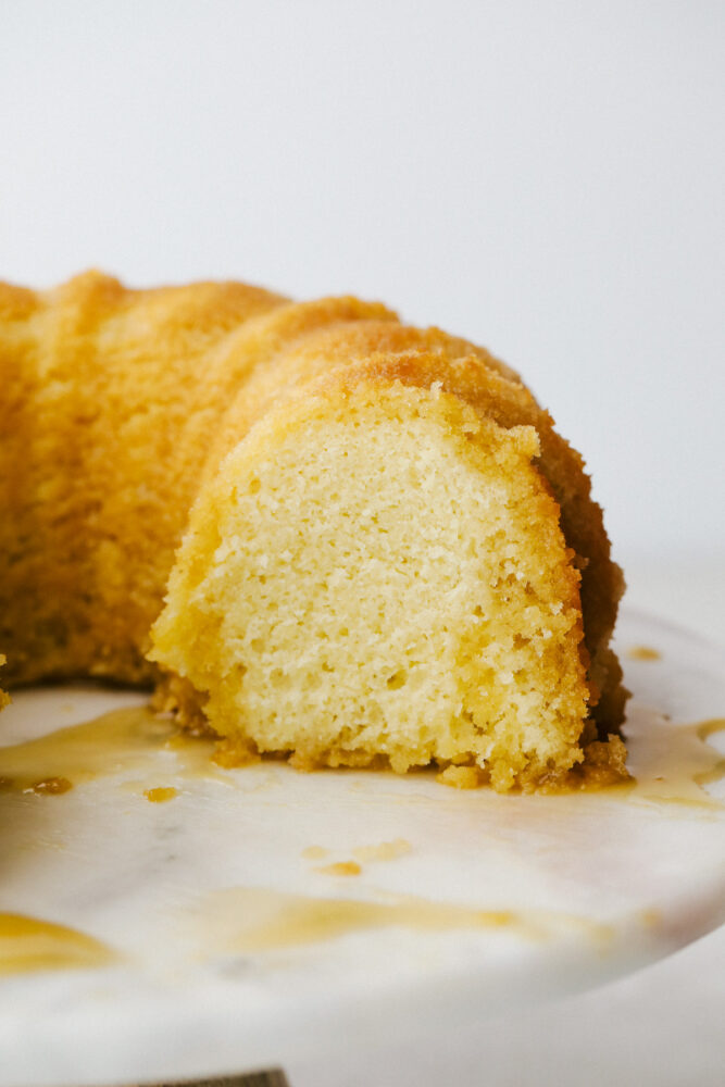 Rum Cake is a rich dense cake that is overflowing with butter rum flavor that is insanely delicious. This cake is moist and the rum syrup adds a layer of decadence that is next level amazing! The rum cake with the drizzle all over it.