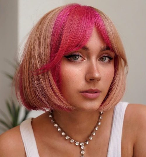 Concave Bob Haircut with Pink Curtain Bangs Blonde Bob with Raspberry Block Highlights