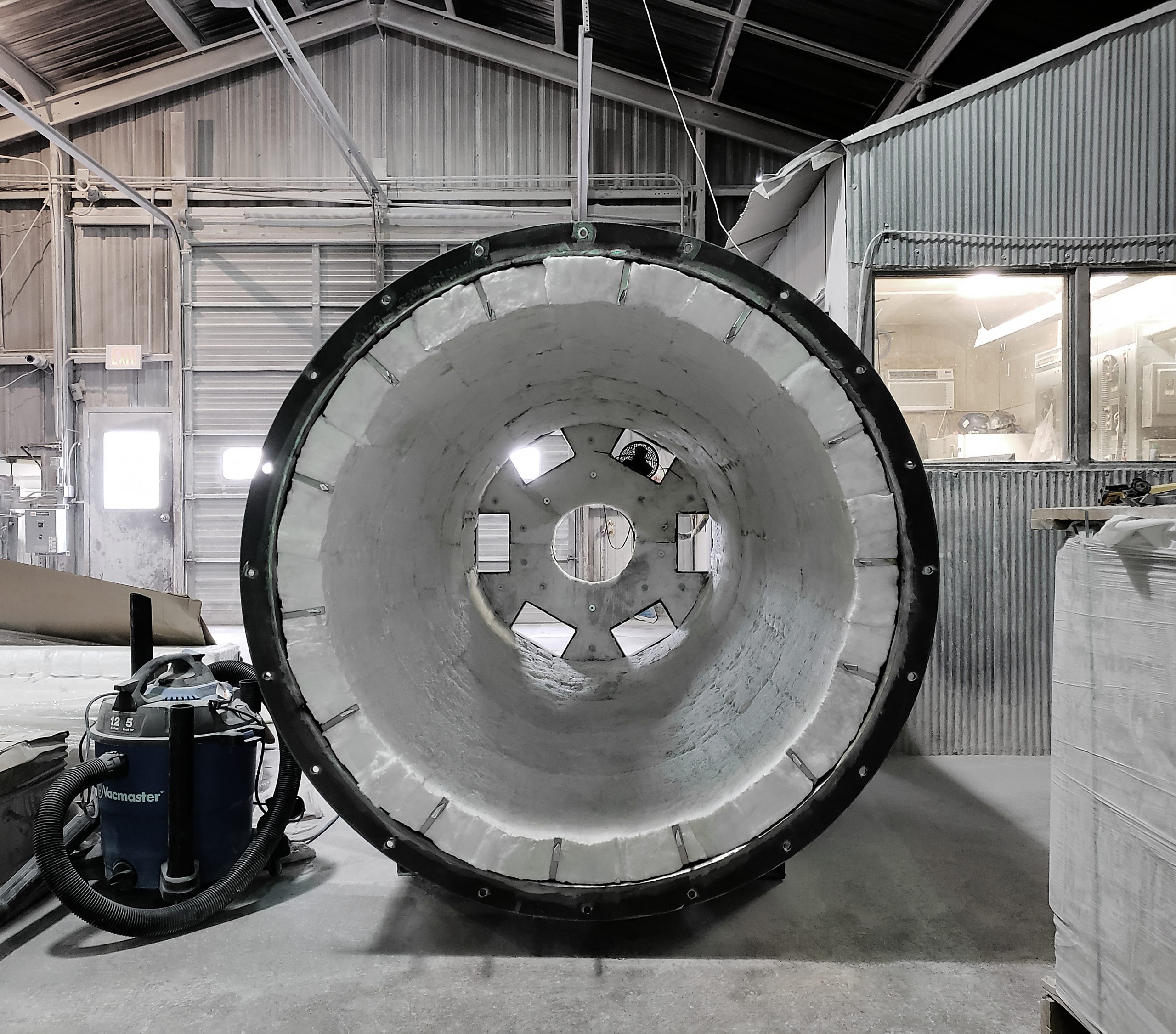 Ceramic fiber module lining installation on a curved vessel wall