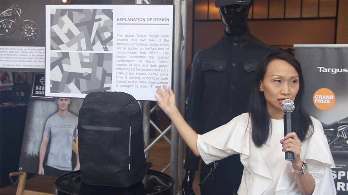 Edith Ka, APAC Managing Director of Targus, explains the unique camouflage design that will be applied on the custom bike's fuel tank.