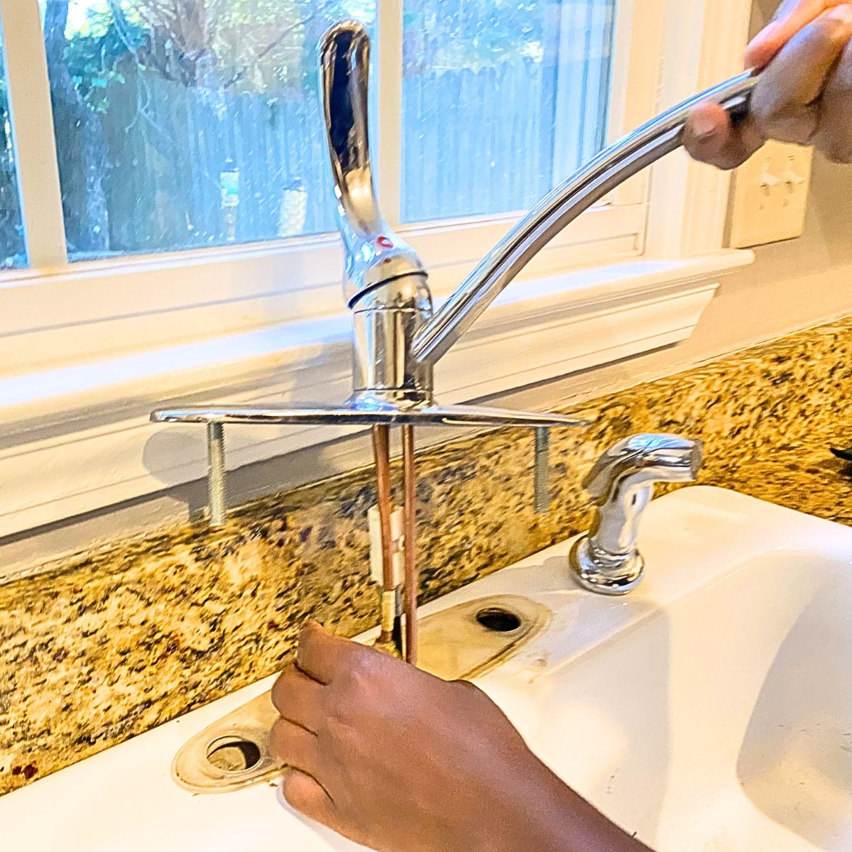 How to Install a Kitchen Sink Faucet Without a Plumber