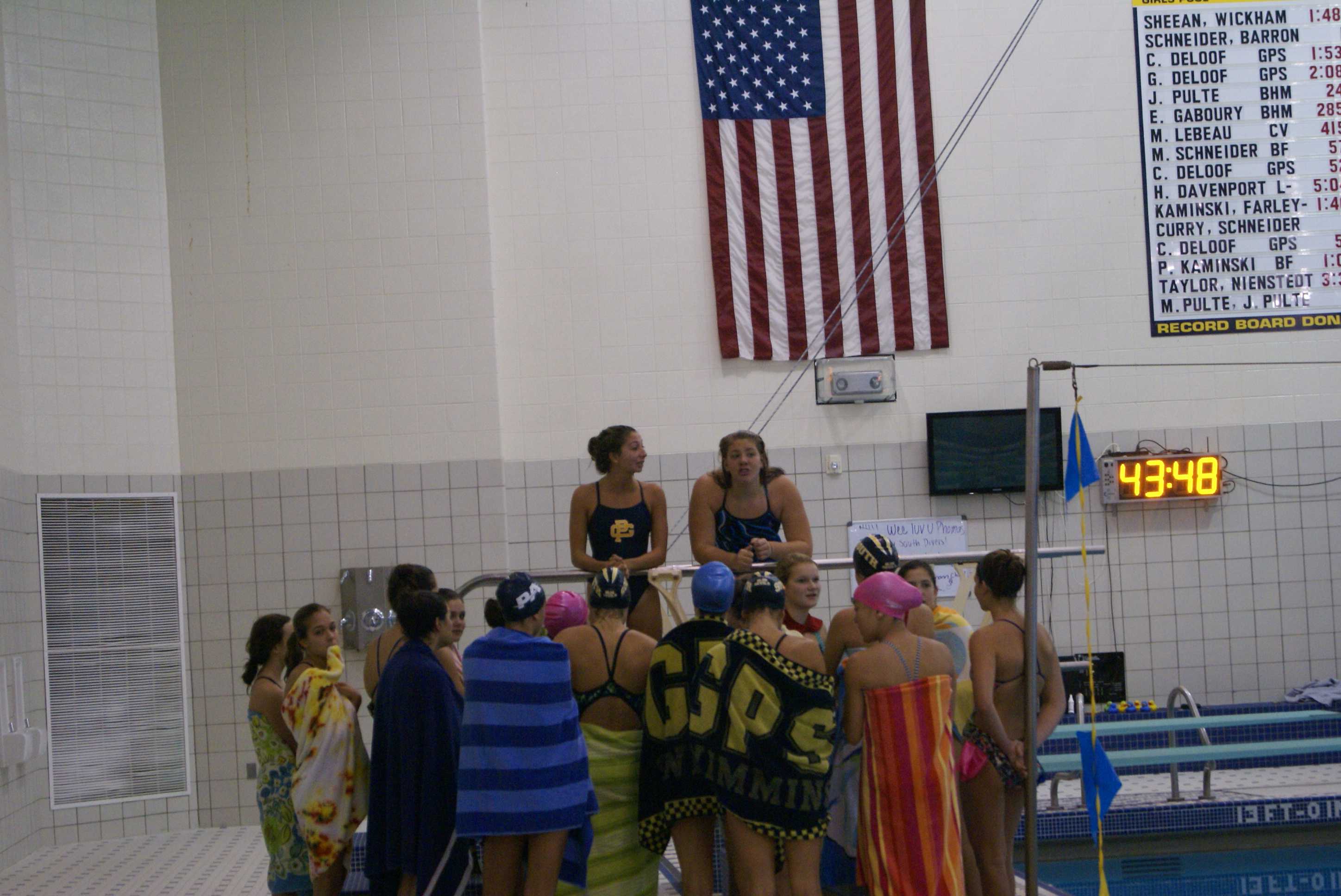 Photo By Devlin Francis ’15 Girls Swim team members gathering around