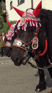 The Manes of the Horses are decorated with colorful twine and metal ornamentation.