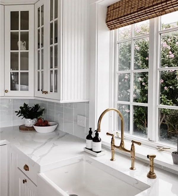beach house kitchen with brass hardware
