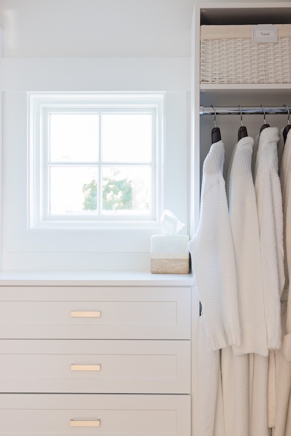 bath robes organized in closet