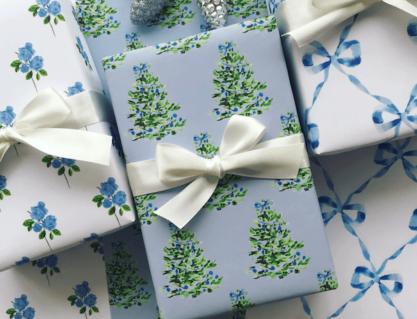 Blue wrapped holiday presents with white bows