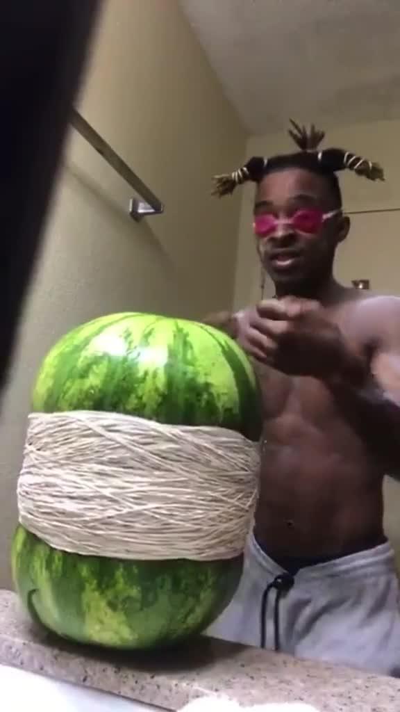 Guy in Self Isolation Puts Rubber Bands on Watermelon to Make it